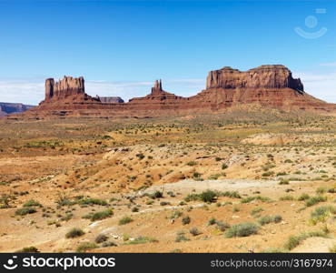 Scenic desert landscape with mountains and mesas.