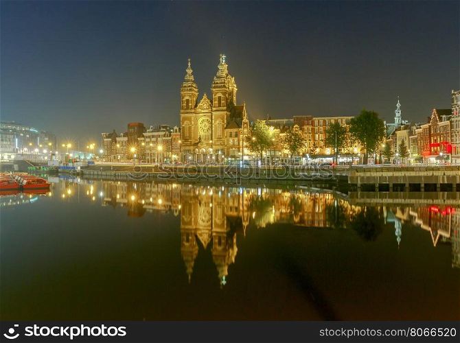 Scenic evening view of the church of St. Nicholas in Amsterdam. Netherlands.. Amsterdam. The church of St. Nicholas.