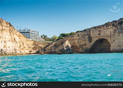 Scenic golden cliffs near Benagil, Portimao. This beach is a part of famous tourist region Algarve