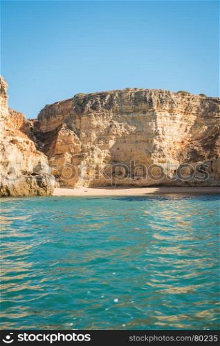 Scenic golden cliffs near Benagil, Portimao. This beach is a part of famous tourist region Algarve