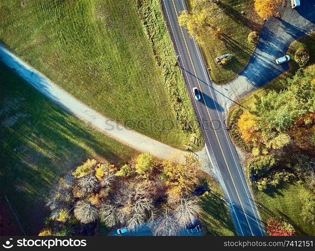 Scenic highway at autumn in New Hampshire, USA. Fall in New England. Aerial drone shot. 