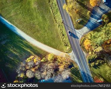 Scenic highway at autumn in New Hampshire, USA. Fall in New England. Aerial drone shot. 