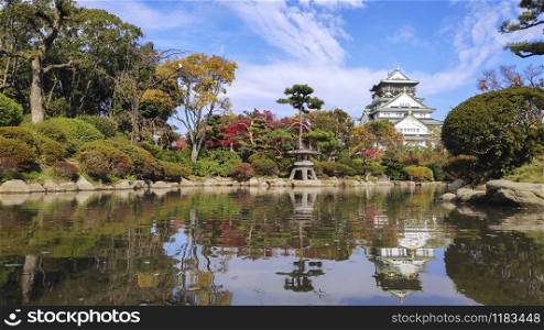 Scenic landscape of Osaka Castle Park, with Osaka Castle reflecting in a pond