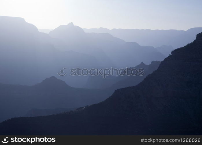 Scenic Layers of the Grand Canyon in the Early Morning with Hikers Cabin Roof Shining in the Lower Middle.