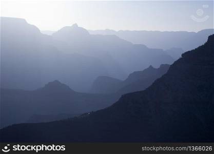 Scenic Layers of the Grand Canyon in the Early Morning with Hikers Cabin Roof Shining in the Lower Middle.
