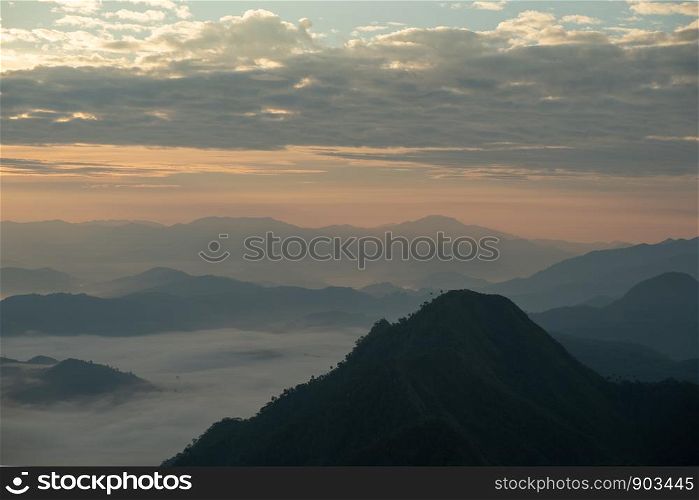scenic mountain lined with alternates. The morning sun shines and fog covered the mountain. Doi KALHEPU, Mae Moei, Tak in Thailand