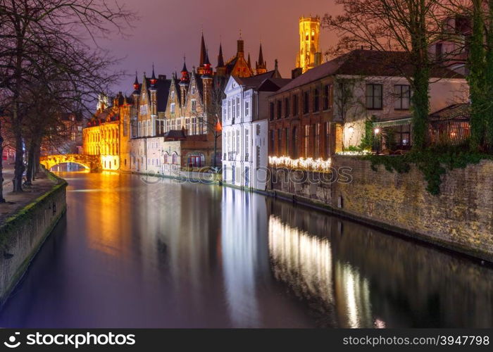 Scenic night cityscape with a medieval tower Belfort and the Green canal, Groenerei, in Bruges, Belgium