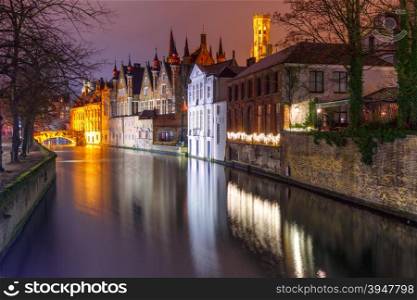 Scenic night cityscape with a medieval tower Belfort and the Green canal, Groenerei, in Bruges, Belgium