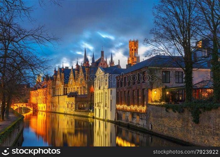 Scenic night cityscape with a medieval tower Belfort and the Green canal, Groenerei, in Bruges, Belgium