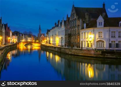Scenic night cityscape with views of Spiegelrei and Jan van Eyckplein in Bruges, Belgium