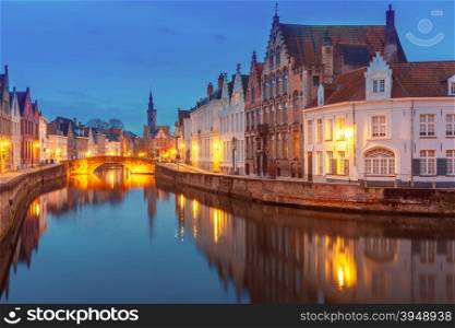 Scenic night cityscape with views of Spiegelrei and Jan van Eyckplein in Bruges, Belgium