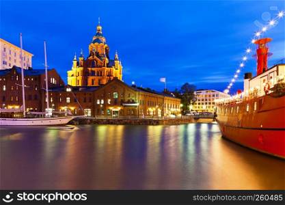 Scenic night panorama of the Uspenski Orthodox Cathedral Church pier architecture in Katajanokka District in the Old Town of Helsinki, Finland