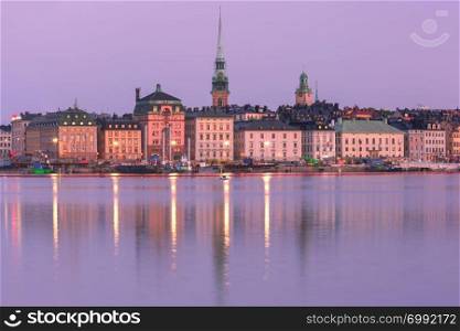 Scenic panoramic view of Gamla Stan, in the Old Town in Stockholm at night, capital of Sweden. Gamla Stan in Stockholm, Sweden