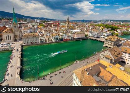 Scenic panoramic view of the city and the bridge Munsterbrucke on a sunny day. Zurich. Switzerland.. Zurich. Panoramic aerial view of the city on a sunny day.