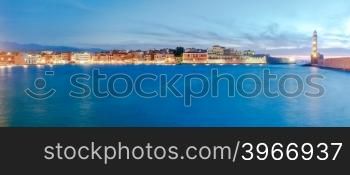 Scenic panoramic view of the old harbor with the lighthouse in Chania during twilight. Crete, Greece.