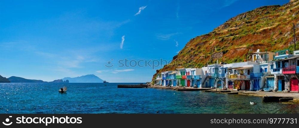 Scenic picturesque greek fishing village Klima with whitewashed traditional houses and colorful windows and doors on Milos island in Greece. Greek fishing village Klima on Milos island in Greece