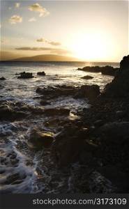 Scenic rocky coast during sunset in Maui Hawaii.