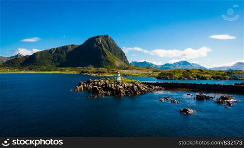 Scenic seascape with lighthouse at Hovsund fishing port, Gimsoya Lofoten Islands in Norway. Lighthouse Hovsund Lofoten Islands Norway