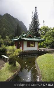 Scenic shot of a pagoda with stream in Iao Valley State Park in Maui, Hawaii.