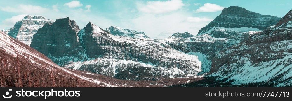 Scenic snow-covered peaks in winter in the Glacier National Park, Montana, USA. Instagram filter.