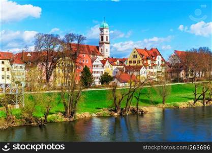 Scenic spring view of old buildings at Danube river pier and street architecture in the Old Town of Regensburg, Bavaria, Germany