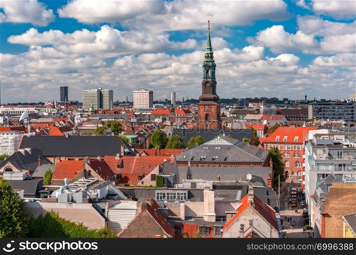Scenic summer aerial view of Old Town skyline with St. Peter&rsquo;s Church and lot of red roofs as seen from The Round Tower, Copenhagen, capital of Denmark. Aerial view of Copenhagen, Denmark