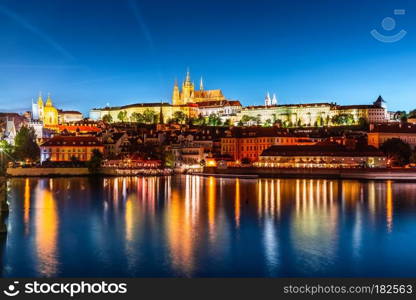 Scenic summer evening panorama of the Old Town architecture with Vltava river, Charles Bridge and St.Vitus Cathedral in Prague, Czech Republic