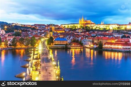 Scenic summer evening panorama of the Old Town architecture with Vltava river, Charles Bridge and St.Vitus Cathedral in Prague, Czech Republic