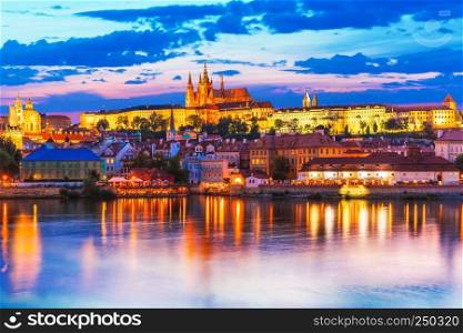 Scenic summer evening panorama of the Old Town architecture with Vltava river and St.Vitus Cathedral in Prague, Czech Republic