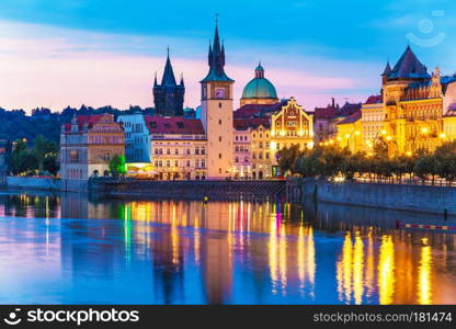 Scenic summer evening view of the Old Town ancient architecture and Vltava river pier in Prague, Czech Republic