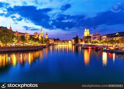 Scenic summer evening view of the Old Town pier architecture and Limmat river embankment in Zurich, Swizerland