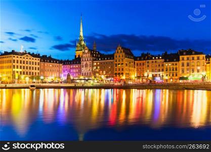 Scenic summer night panorama of the Old Town (Gamla Stan) architecture pier in Stockholm, Sweden