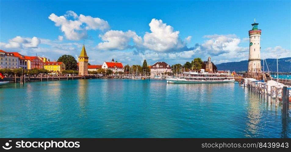 Scenic summer panorama view of the Old Town pier architecture and ancient lighthouse tower in Lindau, Bodensee or Constance Lake, Germany