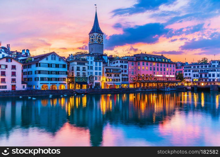 Scenic summer sunset view of the Old Town pier architecture and Limmat river embankment in Zurich, Swizerland