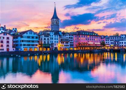 Scenic summer sunset view of the Old Town pier architecture and Limmat river embankment in Zurich, Swizerland