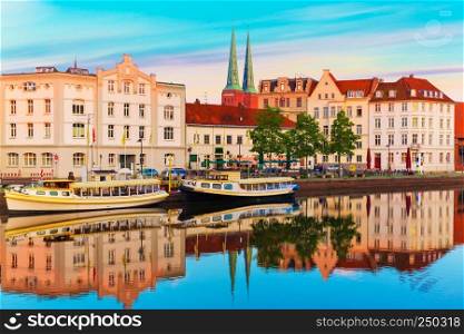 Scenic summer sunset view of the Old Town pier architecture in Lubeck, Germany