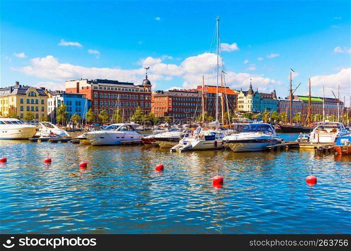 Scenic summer view of the Old Town architecture and pier with yachts and boats in the Old Port in Helsinki, Finland