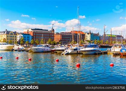 Scenic summer view of the Old Town architecture and pier with yachts and boats in the Old Port in Helsinki, Finland