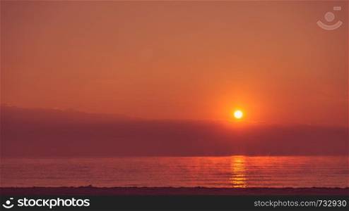 Scenic sunrise or sunset over sea surface, Greece. Sunrise or sunset over sea surface
