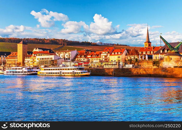 Scenic sunset evening view of old buildings at Main river pier and street architecture in the Old Town of Wurzburg, Bavaria, Germany