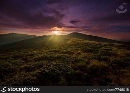 Scenic Sunset in the mountains. Beautiful natural background.