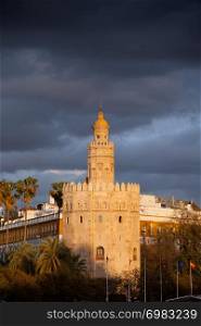 Scenic Torre del Oro (Gold Tower) at sunset, medieval landmark from early 13th century in Seville, Spain, Andalusia region.