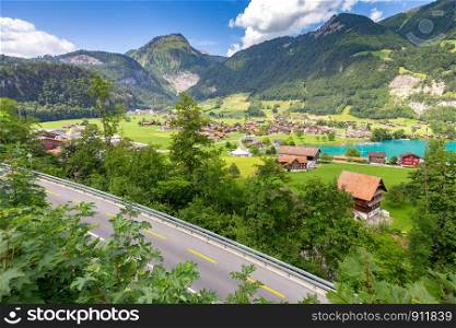 Scenic view of a traditional medieval alpine village on a sunny day. Lungern Switzerland.. Lungern. Old medieval village in the swiss alps.