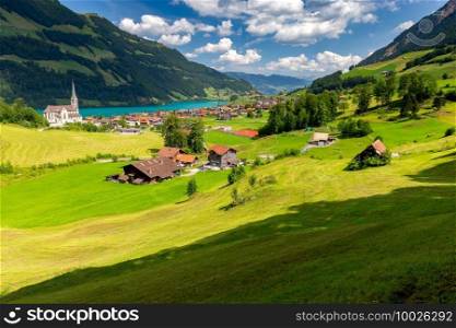 Scenic view of a traditional mountain alpine village on a sunny day. Lungern, Switzerland.. An old medieval village in the Swiss Alps.
