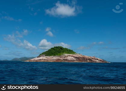 Scenic view of Booby rock Island, with and horizon over the sea. Praslin, Seychelles