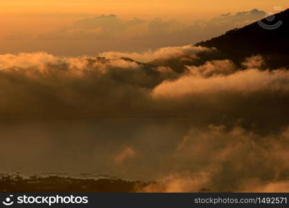 Scenic view of clouds and mist at sunrise from the top of mount Batur (Kintamani volcano), Bali, Indonesia