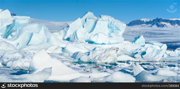 Scenic view of icebergs in Jokulsarlon glacier lagoon, Iceland, selective focus, global warming concept