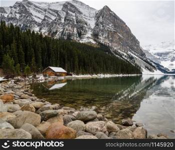 Scenic view of Lake Louise with rock shore in Banff National Park, Alberta, Canada