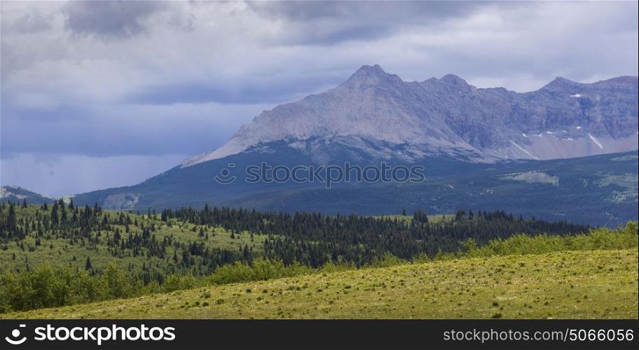 Scenic view of landscape with mountain range in the background, Glacier National Park, Glacier County, Montana, USA