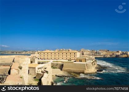 Scenic view of Maniace castle on sea, Syracuse, Sicily, Italy